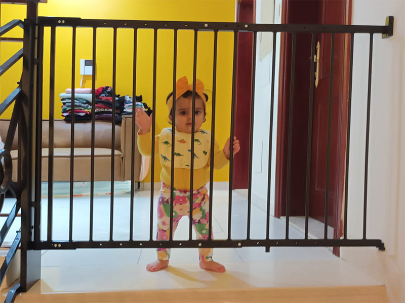 Baby-safety-gate-for stairs-with-baby-secured